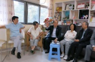 The Secretary for Labour and Welfare, Mr Matthew Cheung Kin-chung (centre), visited the Home Care for Girls in Tsing Yi and was briefed by its founder and Executive Director, Sister Agnes Ho (second left), and Chairperson, Mrs Minnie Li (second right), on the residential care services it provides for children in need.