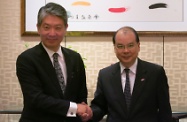 Mr Cheung (right) was pictured with Mr Yoshiteru Uramoto.