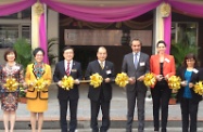 The Secretary for Labour and Welfare, Mr Matthew Cheung Kin-chung (centre), Dr Aron Harilela (third right) and Mrs Harilela (second right), Chairman of Po Leung Kuk, Dr Eric Cheng (third left) and other officiating guests performing the ribbon-cutting ceremony of the Po Leung Kuk Padma and Hari Harilela Integrated Rehabilitation Centre.