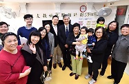 The Secretary for Labour and Welfare, Dr Law Chi-kwong, visited Sha Tin District and called at the Hong Kong Single Parents Association (HKSPA) Jockey Club Neighbourhood Support Centre operating the Neighbourhood Support Child Care Project under the Social Welfare Department. Photo shows Dr Law (eighth right); the Under Secretary for Labour and Welfare, Mr Caspar Tsui (ninth right); the District Social Welfare Officer (Sha Tin), Mrs Gloria Lee (10th right); and the Chief Executive of the HKSPA, Ms Jessie Yu (first right), with home-based carers and children receiving care services.