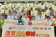Mr Cheung (centre) is pictured with the officiating guests and over a thousand participants of the ceremony.