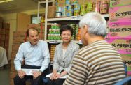The Chief Secretary for Administration, Mrs Carrie Lam (second left), and the Secretary for Labour and Welfare, Mr Matthew Cheung Kin-chung (first left), chat with an elderly person at the People's Food Bank to get an understand on the difficulties he faces in his daily life.