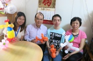 Picture shows Mr Cheung (second left) paying home visit to one of the former hidden youth (second right). On the first left is the social worker of the Hong Kong Christian Service.