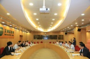 Mr Cheung (fifth left) meets with the Tsuen Wan District Council Chairman, Mr Chan Iu-seng (sixth left), and District Council members to exchange views on labour and welfare issues.