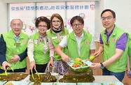 The Secretary for Labour and Welfare, Mr Stephen Sui (second right) and guests prepared lunch  for the elderly at a community canteen to celebrate Tuen Ng Festival.