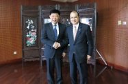 The Secretary for Labour and Welfare, Mr Matthew Cheung Kin-chung (right), is pictured with the Vice Minister of Civil Affairs, Mr Gu Chaoxi (left), in Beijing (July 27).