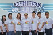 Mr Cheung (centre) is pictured with some of the most improved trainees of YETP.