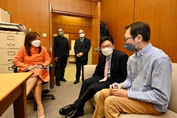 The Secretary for Labour and Welfare, Mr Chris Sun, visited the Hong Kong Office of the Selective Placement Division of the Labour Department in the Harbour Building, Central, this afternoon (October 27) to give encouragement to job seekers with disabilities and frontline personnel. The Commissioner for Labour, Ms May Chan, also joined the visit. Photo shows Mr Sun (second right), accompanied by Ms Chan (first left), listening to a person with a disability on the training he receives and his job-searching experience.