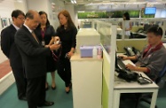 Mr Cheung (second left) and the Under Secretary for Labour and Welfare, Mr Stephen Sui (first left), visit the Association's 24-hour Call and Care Centre where they are briefed by the Chief Executive Officer of the Association, Ms Irene Leung (fourth left), on the Centre's round-the-clock emergency support and care services for elderly users.