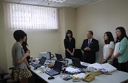 The Secretary for Labour and Welfare, Mr Matthew Cheung Kin-chung (third right), visits the Office of the Government of the Hong Kong Special Administrative Region of the People's Republic of China in Beijing (Beijing Office) to exchange views with university students from Hong Kong who had taken up internship placement at the office during the summer holiday. Looking on is the Director of the Beijing Office, Ms Gracie Foo (first right).