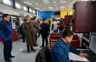 The Secretary for Labour and Welfare, Dr Law Chi-kwong, conducted his second-day visit programme in Beijing. Photo shows Dr Law (second left) touring around the teaching facilities at Beijing Industrial Technician College.