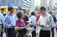 The Secretary for Labour and Welfare, Mr Matthew Cheung Kin-chung (first right); the Under Secretary for Labour and Welfare, Mr Stephen Sui (first left); and the Political Assistant to the Secretary for Labour and Welfare, Ms Jade Lai; distributed leaflets to members of the public in Tai Wai to appeal for their support for the Government's proposals on the method for selecting the Chief Executive by universal suffrage.