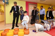 The Secretary for Labour and Welfare, Dr Law Chi-kwong, visited Hong Kong Christian Service Morrison Hill Child Development Centre in Wan Chai. Photo shows Dr Law (first left) observing children with special needs receiving physical exercise training at the centre.