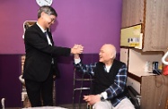 The Secretary for Labour and Welfare, Dr Law Chi-kwong, visited Po Leung Kuk Wan Chai Home for the Elderly cum Day Care Centre for the Elderly. Photo shows Dr Law (left) interacting with an elderly man at the centre.