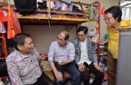 The Secretary for Labour and Welfare, Mr Matthew Cheung Kin-Chung (second left) visited elderly singletons in Wong Tai Sin with Member of Legislative Council, Ms Chan Yuen-han (first right) and the President of Hong Kong Economic and Trade Association, Dr Eddy Li (second right). They showed their concern to the elderly people by giving them electrical appliances and rice dumplings.