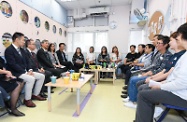 The Secretary for Labour and Welfare, Dr Law Chi-kwong, visited Heep Hong Society Lei Yue Mun Centre this afternoon (October 31). Photo shows Dr Law (third left) exchanging views with the centre's staff and parents to learn more about how the pre-school to adult support services and after school support could relieve their burden of taking care of their children.