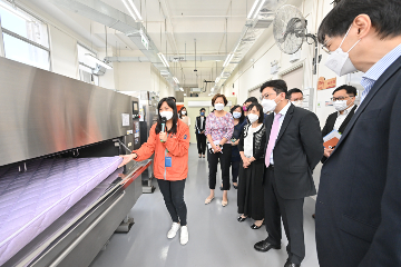 The Secretary for Labour and Welfare, Mr Chris Sun, visited the Jockey Club 'age at home' Gerontech Education and Rental Service Centre, and the Gerontech Cleaning and Maintenance Service Centre (CMSC) this afternoon (September 8) to keep abreast of their latest services. The Under Secretary for Labour and Welfare, Mr Ho Kai-ming, and the Director of Social Welfare, Miss Charmaine Lee, also joined the visits. Photo shows (front row, from second right) Mr Sun and Miss Lee looking at the cleaning and disinfection of a mattress in the CMSC.